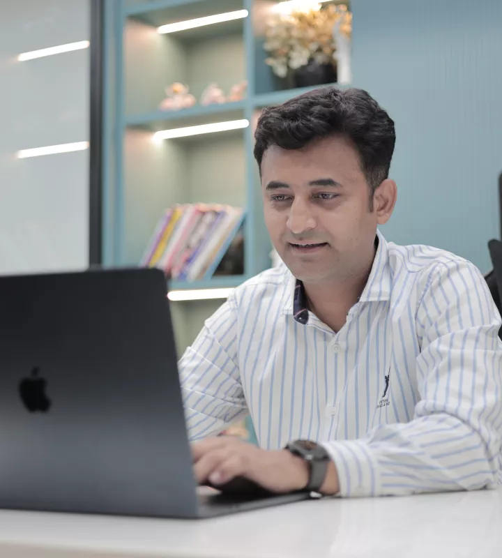 Team member working on a laptop